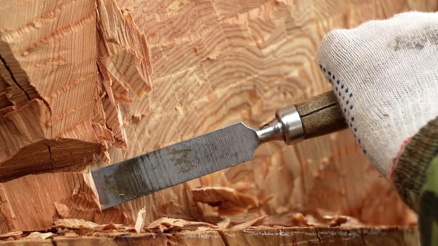 An exquisite artistic display of woodworking, showcasing intricate and precise chisel techniques on fresh wood. Stock Clip