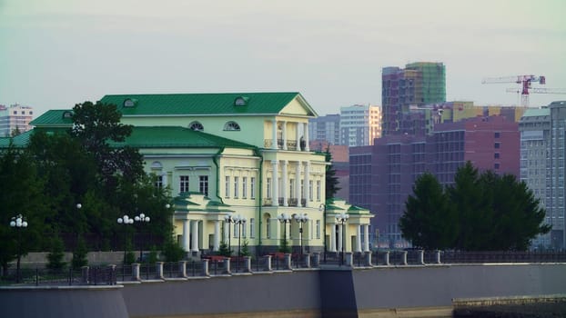 A stunning historic structure beautifully contrasts with sleek modern buildings that define the city skyline. Stock Clip