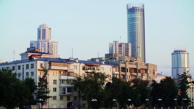 A vibrant city skyline showcasing a captivating mix of modern skyscrapers and diverse residential buildings. Stock Clip