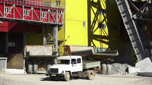 Tbilisi, Georgia - August 02, 2024: A lively and bustling construction site is vividly displaying dump trucks and heavy machinery actively working. Stock Clip