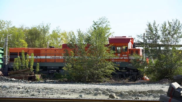 An abandoned train, taken over by greenery, illustrates natures ability to reclaim industrial spaces. Stock Clip