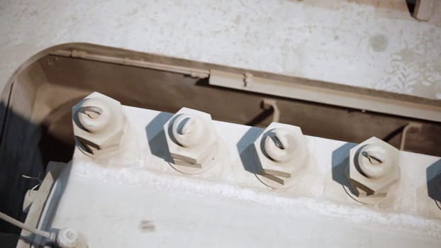 The image shows a closeup of a component in industrial machinery, highlighting its intricate features. Stock Clip