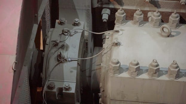 A detailed view reveals intricate industrial machinery, emphasizing the electrical components and extensive wiring used. Stock Clip