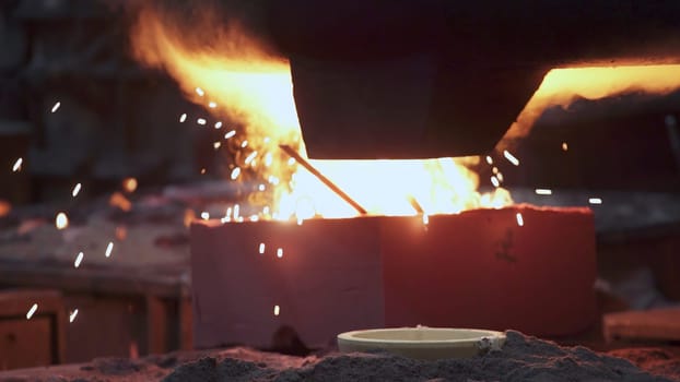 A dynamic scene of molten metal being poured in a foundry, showcasing industrial processes and craftsmanship. Stock Clip