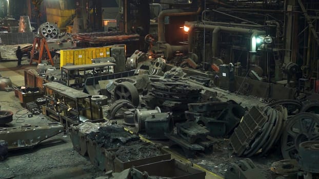 An energetic and bustling industrial workshop that is filled with various machinery and equipment in active use. Stock Clip
