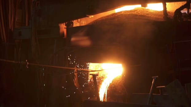 A captivating display of molten metal poured skillfully in a foundry, showcasing intricate industrial techniques. Stock Clip