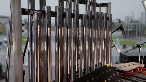 A closeup view of a sleek, modern percussion instrument setup designed specifically for an outdoor performance event. Clip
