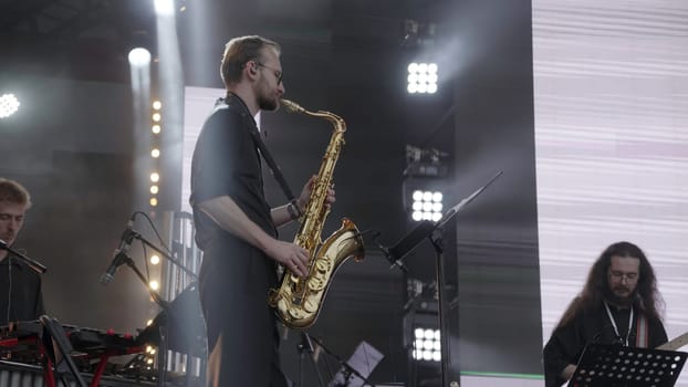 Georgia, Tbilisi - July 20, 2024: An exciting and dynamic live music scene featuring a saxophonist and a flutist performing with great energy and passion. Clip