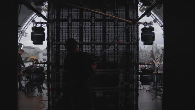 Georgia, Tbilisi - July 20, 2024: A shadowy figure skillfully navigating a media stocking space that features dynamic lighting and a sleek, modern setup. Clip