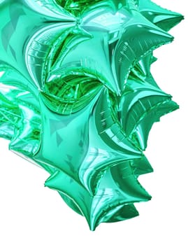 A cluster of shiny green star-shaped balloons is displayed, creating a lively and cheerful atmosphere for a party or festive occasion.