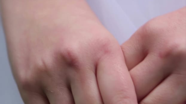 A closeup view of a wrist that beautifully showcases a shimmering bracelet set against smooth skin