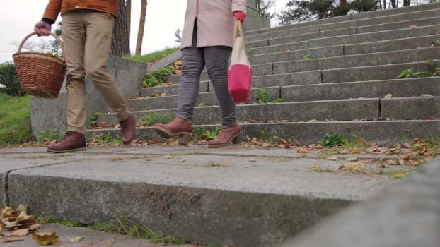 This video shows people on a stairway a couple ascending, a man and woman descending, and a solo figure going up, highlighting movement