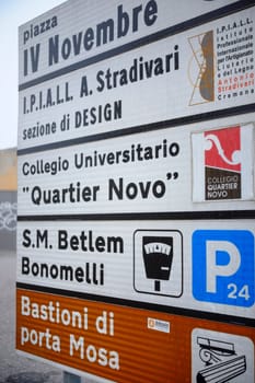 Cremona, Lombardy, Italy - November 7th 2024 Road sign indicating various locations including piazza iv novembre. Antonio stradivari institute. Bastioni porta mosa. Parking and more in cremona