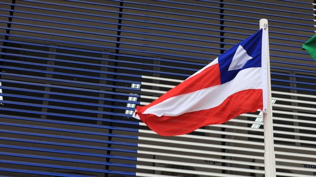 salvador, bahia, brazil - september 18, 2023: Bahia state flag seen on a flagpole in the city of Salvador.