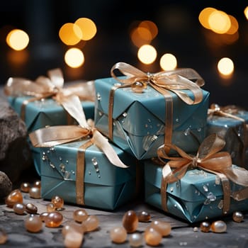 Gift boxes decorated with wrapping paper and ribbons in blue and gold tones. High quality photo