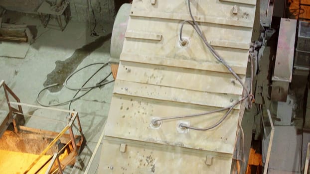 Heavy machinery is actively operating in a quarry, demonstrating various processes involved in mineral extraction. Stock Clip