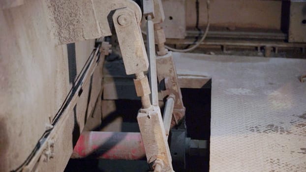 Close up of industrial machinery, highlighting hydraulic mechanisms and operational components in the processes. Stock Clip