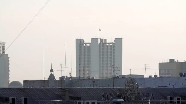 A distant view of urban buildings under a hazy sky, beautifully showcasing the essence of city life and architecture. Stock Clip