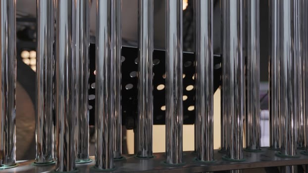 This is an intriguing abstract installation that incorporates glass tubes to create captivating patterns and shadows. Clip