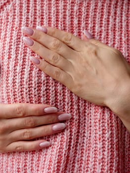 Pink October Breast Cancer Awareness month, woman hand with pink Ribbon in hospital for support people life and illness. Vertical