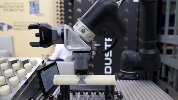 Dubai, UAE - June 2024: An advanced robotic arm showcases the latest automation technology in modern manufacturing processes. Media