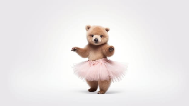 A playful brown bear cub dressed in a fluffy pink tutu is joyfully dancing on its hind legs. Its tiny paws are raised high, exuding charm and cuteness, set against a bright white background.