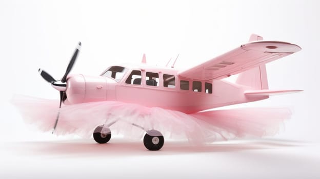 This image features a small pink airplane adorned with a fluffy pink tulle skirt. It is on the ground with a white background, captured from a side angle, showcasing a creative, unique concept.