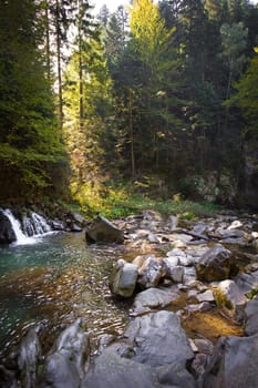 Very beautiful waterfall in autumn in the forest. Ukraine, Carpathians.