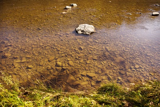 the river in the Carpathians, all in the rocks is clean and very clear water, the top view.