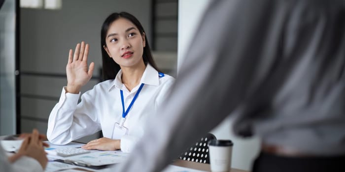 Asian business team meeting to analyze and discuss the situation on the financial report in the meeting room. Investment Consultant, Financial advisor and accounting concept.