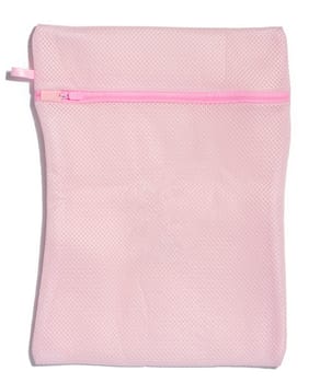 Pink bag for washing clothes in a washing machine on a white background