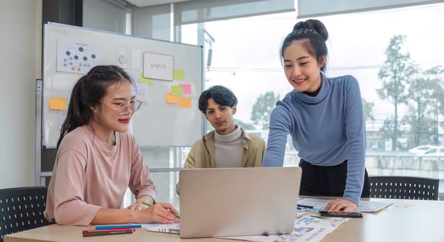 Asian office team brainstorming, plan for solution idea, Group of asian creative teamwork and woman leader at business meeting for developing mobile phone app, ux, ui start up, small business.