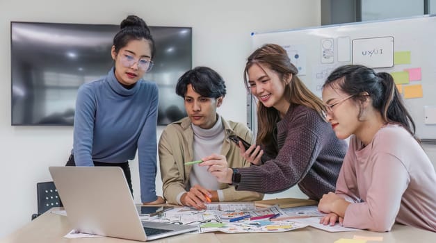 Asian office team brainstorming, plan for solution idea, Group of asian creative teamwork and woman leader at business meeting for developing mobile phone app, ux, ui start up, small business.