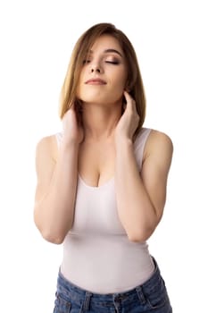 Young sexy girl wearing white top and jeans isolated cropped shot