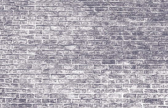An abstract old brick wall in gray and white tones is depicted on paper
