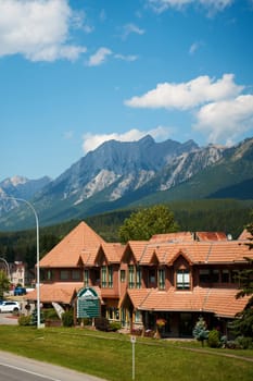 Beautiful picturesque old houses in the Canadian town of Canmore in the mountains. Canmore, Canada - 08.03.2023