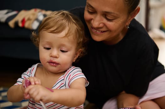 A joyful moment captured between a loving mother and her young child as they spend quality time together in a cozy home setting.