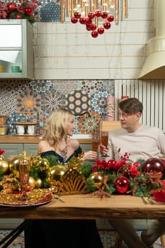 romantic man relationship woman christmas husband caucasian kitchen family couple home love wife