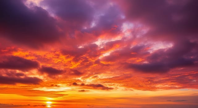 Dramatic sunset scene featuring an expansive sky filled with vibrant red and purple clouds. the interplay of warm and cool tones creates a striking, inspirational backdrop perfect for landscape photography themes.