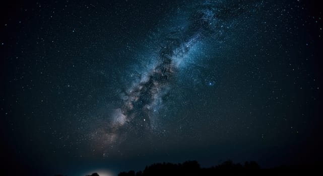 A breathtaking display of the milky way galaxy stretching across a clear night sky. the dense starry expanse casts a luminous glow, while a forested horizon adds depth to this stunning celestial scene.