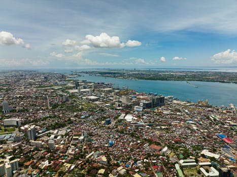 Aerial drone of Cebu city with port, modern buildings and business districts. Philippines.