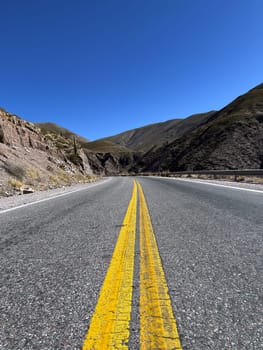 Tourism in Jujuy in a sunny winter day. Tourism in the north of Argentina. Winter holidays in Argentina. Background for tourism promotions and brochures. Concept of mountain tourism