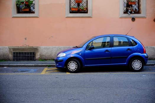 Cremona, Itally - October 6th 2024 Bright blue citroen c3 pluriel parked on a residential street, showcasing urban parking and european car culture