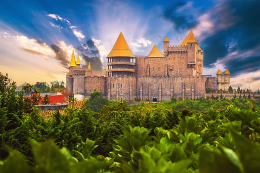 Fairy fabulous beautiful medieval castle at sunrise in Ba Na Hills Park in Da Nang in Vietnam in summer