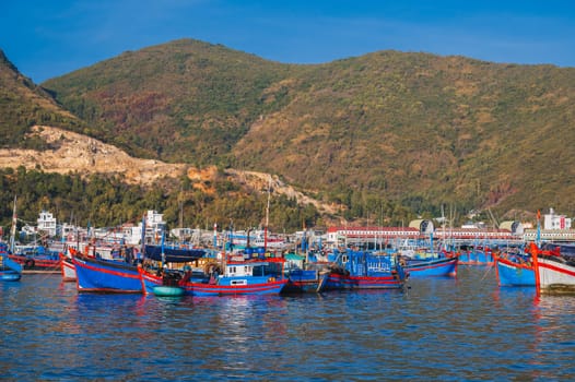 Traditional Vietnamese fishing boats, ships and vessels at the seaport on river in Nha Trang. Nha Trang, Vietnam - September 8, 2024