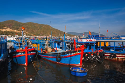 Vietnamese fishing boats, ships and vessels at the fishing port Vinh Truong on river in Vietnam. Nha Trang, Vietnam - September 8, 2024