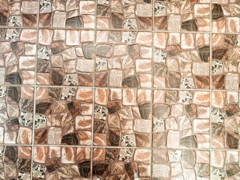 Detailed stone tiles in earthy tones enhance the warmth and style of the surrounding space, perfect for a cozy environment.