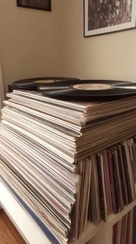 A nostalgic stack of vintage vinyl records in sleeves, capturing the essence of retro music culture.