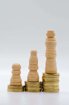 Status and ambition represented by pawns on golden coins with customizable space for text.