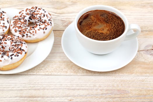 Enjoy chocolatecovered donuts with fresh brewed coffee a perfect choice for breakfast or a tasty snack anytime